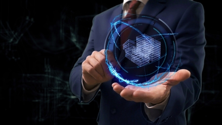Businessman shows concept hologram 3d money on his hand. Man in business suit with future technology screen and modern cosmic backgroundの写真素材