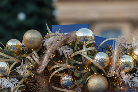 Christmas decoration with gold and silver balls and tinsel on the streetの写真素材