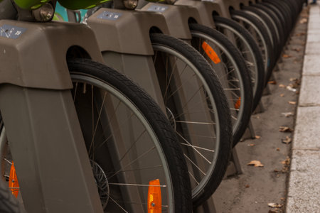 Bicycles parked in a row on a street in Paris, Franceの写真素材