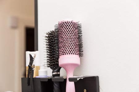 Hair dryer and comb in hairdresser's salonの写真素材