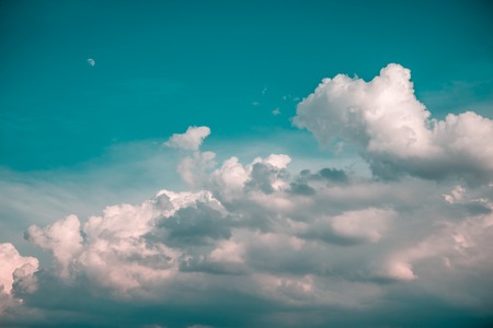 Moon and clouds in summer blue skyの写真素材