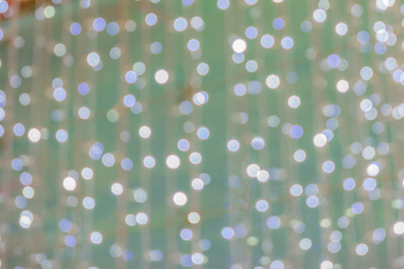 Blurring background for a holiday greeting card, banner advertising. Shimmering bokeh, lights of the...