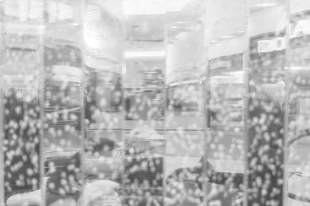 Blurring background for a holiday greeting card, banner advertising. Black and white glass...