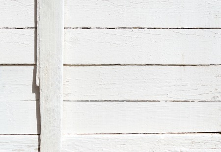 Background of weathered painted white wooden plankの写真素材