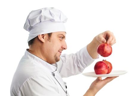 chef in uniform with pomegranatesの写真素材