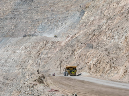 Heavy mining truck in mine and driving alongの写真素材