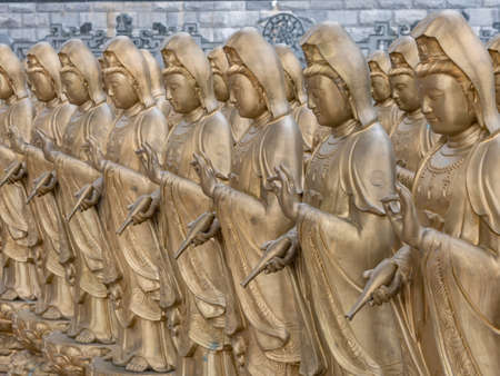The statue of Guanyin or Goddess of Mercy at Chinese buddhist temple, Penang, Malaysiaの写真素材