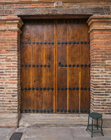 traditional colonial era door in the streets of Bogota, Columbiaのeditorial素材