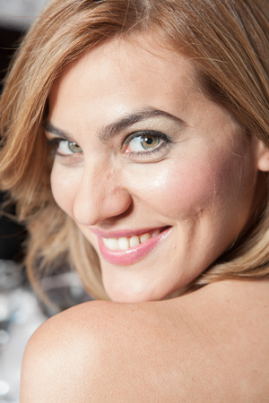 Pretty woman looking at cameraの写真素材