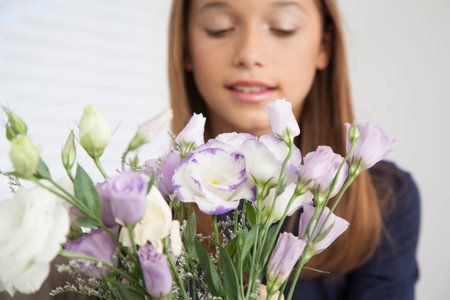 Young girl with a bouquetの写真素材