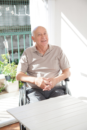 Portrait of an old man in his roomの写真素材