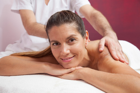 Happy woman getting a massageの写真素材