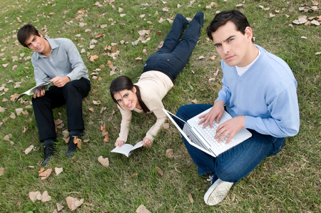 Friends looking at something on the computerの写真素材