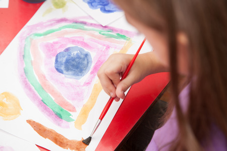 Girl drawing with watercolorsの写真素材