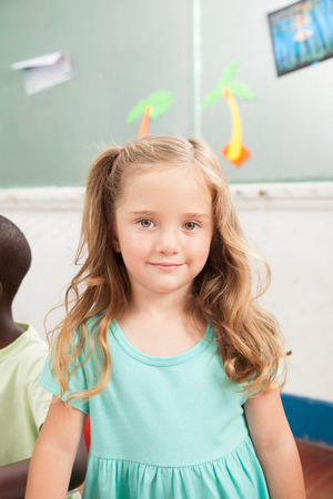 Young girl playing in kindergardenの写真素材