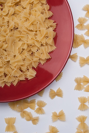 Noodles on red plateの写真素材