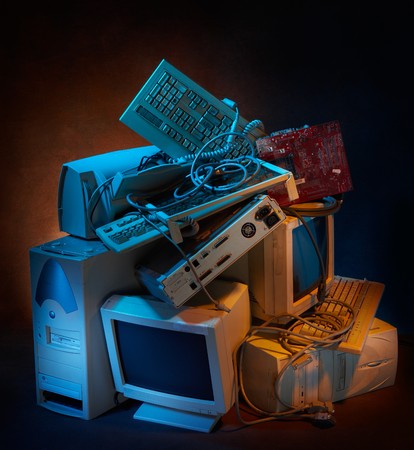 stack of old computer equipment with dramatic lightingの写真素材