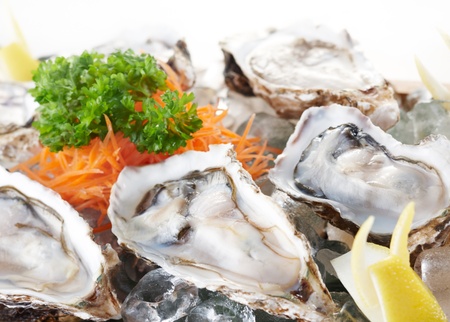 fresh and delicious raw oysters as food backgroundの写真素材
