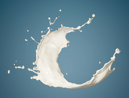 fresh milk splashing isolated on blue backgroundの写真素材
