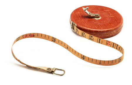 old-fashioned tape measure isolated on white backgroundの写真素材