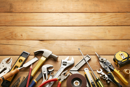 variety of tools on wood planks with copy spaceの写真素材
