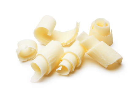 group of white chocolate shavings isolated on whiteの写真素材