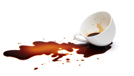 cup of black coffee spilling causing stainedの写真素材