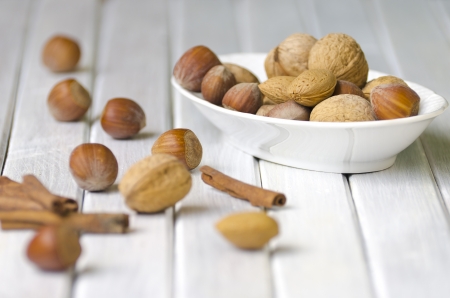 Still life with nuts on a white tableの写真素材