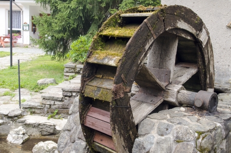Photo of an old water mill wheelの写真素材
