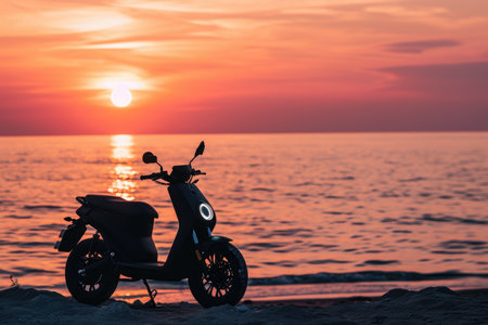 A scooter parked on the sandy beach as the sun sets in the background, casting a warm, orange glow, An electric motorbike parked near a beach at sunset, AI Generatedの素材