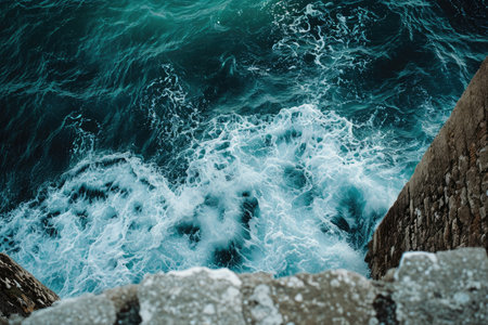 An aerial perspective captures the stunning view of a clear blue lake nestled among lush green hills, Ocean waves seen from a coastal fort, AI Generatedの素材