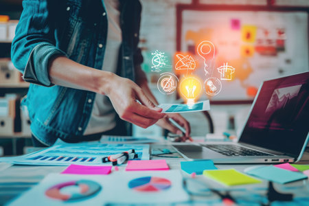 A person sits at a desk, using a laptop computer with icons illuminated on the screen, The fusion of traditional and digital marketing techniques, AI Generatedの素材