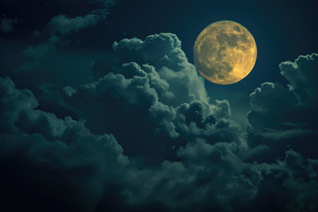 A full moon brightly shines through a sky dotted with grey clouds, The moon's glow piercing the dense cover of storm clouds, AI Generatedの素材