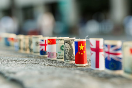 Row of Rolled Up Money on Top of Sidewalk, A parade of currencies with different country flags growing in size to indicate global inflation, AI Generatedの素材