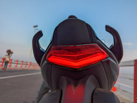 Close Up of the Tail Light of a Motorcycle, A detailed view of the tail light on a motorcycle, showcasing its design and lighting elements.の写真素材
