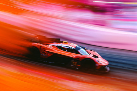 A red race car accelerates down the track, showcasing its power and speed, An abstract representation of the speed and adrenaline of sports car racing, AI Generatedの素材