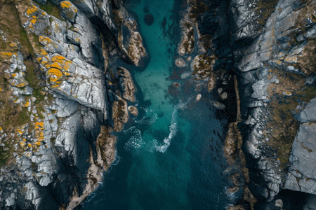 An aerial perspective capturing a body of water enclosed by rocks, showcasing the natural beauty of the landscape, A sky-high view of a narrow sea inlet surrounded by rocks, AI Generatedの素材