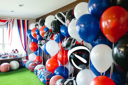 A vibrant room filled with an abundance of balloons and streamers, creating a lively and festive atmosphere, Sports-themed balloons for a fan's birthday party, AI Generatedの素材