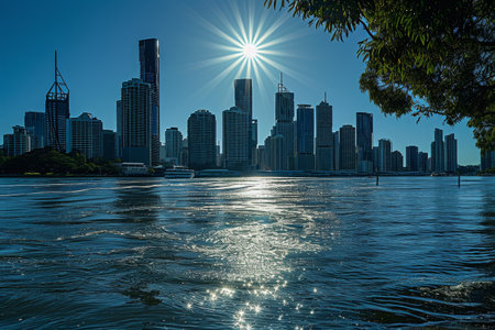 A vibrant cityscape basks in the radiant sunlight of a sunny day, Brisbane's skyline glittering in the midday sun, AI Generatedの素材