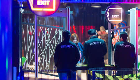Security guard Female Asian Checking weapons in nightclub.のeditorial素材