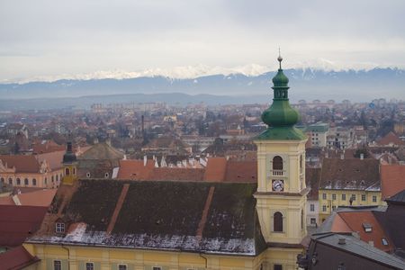Panorama over Sibiu in Romania, overlooking the Carpathian mountains in winter.の写真素材