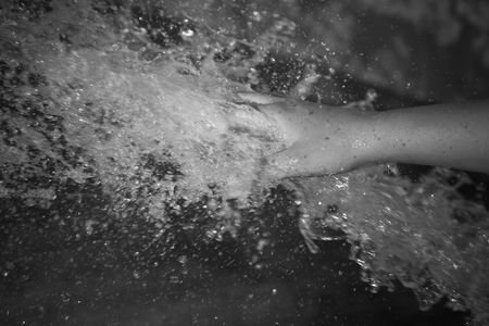 Hand playing in the water.の写真素材