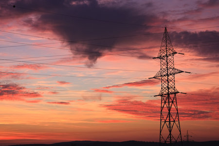 Autumn sunset and electricity poles in Romania.
