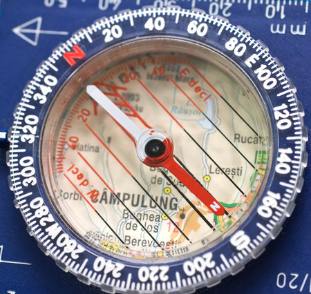 Close up of a compass on a map of Romania.