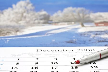 Red pen on a calendar of December.の写真素材