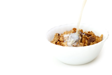 Milk and cereals in a white bowl