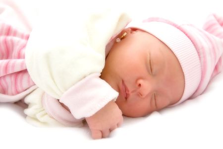 New born baby girl peacefully sleeping.の写真素材