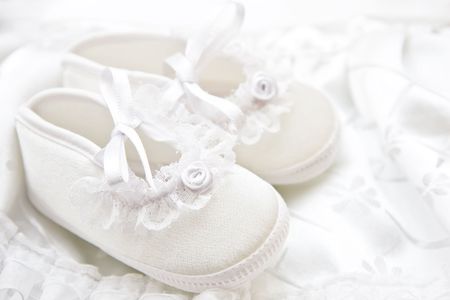 Baby girl shoes for christening.の写真素材