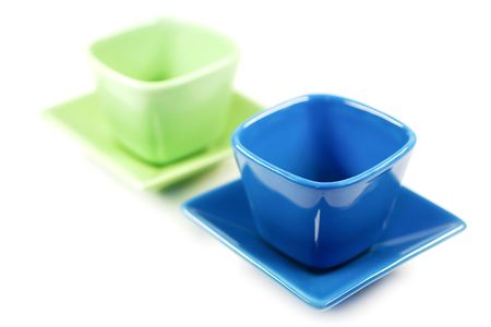 Colorful cups isolated on white.の写真素材