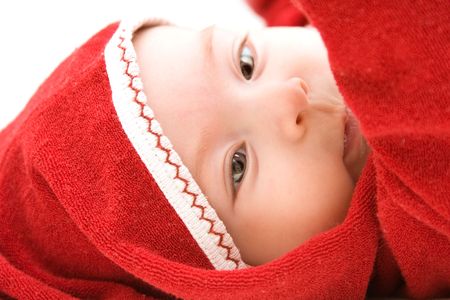 Adorable baby girl dressed in red costume.の写真素材